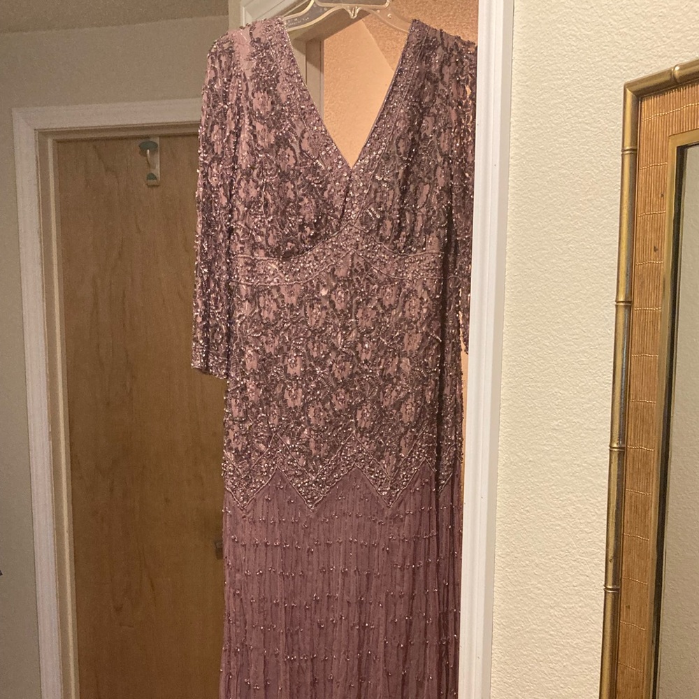 Intricately beaded dress moves beautifully- worn once